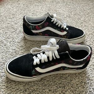 Black vans with flower details